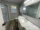 Updated bathroom with a modern vanity, sink, and glass-enclosed shower at 224 Locust Ave, Locust, NC 28097