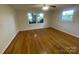 Well lit bedroom showcasing hardwood floors and lots of natural light at 224 Locust Ave, Locust, NC 28097