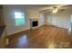 Spacious living area showcasing hardwood floors and natural light at 224 Locust Ave, Locust, NC 28097