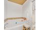 Bright bathroom featuring a tiled bathtub, white walls and tile flooring at 2611 Forest Dr, Charlotte, NC 28211