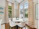 Cozy dining area with large windows and comfortable seating at 2611 Forest Dr, Charlotte, NC 28211