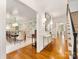 Elegant foyer with hardwood floors, stylish console table, and open view to the dining area at 2611 Forest Dr, Charlotte, NC 28211