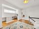 Comfortable upstairs hall area with built-in desk and white wooden floors at 2611 Forest Dr, Charlotte, NC 28211