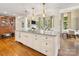 Spacious kitchen island with granite countertop overlooks the living room at 2611 Forest Dr, Charlotte, NC 28211