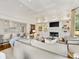 Elegant living room with a fireplace, built-in shelves, and open layout at 2611 Forest Dr, Charlotte, NC 28211