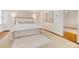 Stylish main bedroom featuring white walls, hardwood floors and an abundance of natural light at 2611 Forest Dr, Charlotte, NC 28211