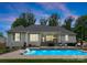 Resort-style backyard with a sparkling pool, covered patio and seating area, perfect for entertaining at 2646 Lee Lawing Rd, Lincolnton, NC 28092