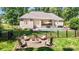 Backyard with a stone fire pit and seating area with a swimming pool at 2646 Lee Lawing Rd, Lincolnton, NC 28092