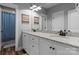 Bathroom features double sinks with granite countertops, white cabinets, and decorative mirrors at 2646 Lee Lawing Rd, Lincolnton, NC 28092