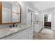 Bright bathroom with double sink vanities, granite countertops, and herringbone wood floors at 2646 Lee Lawing Rd, Lincolnton, NC 28092