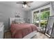 Bright bedroom features a cozy bed, a large window with natural light, and calming decor at 2646 Lee Lawing Rd, Lincolnton, NC 28092