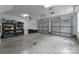 Spacious three-car garage with storage shelves and doors with windows at 2646 Lee Lawing Rd, Lincolnton, NC 28092