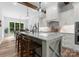 Eat-in kitchen features a large granite island, stainless steel appliances, and open dining area at 2646 Lee Lawing Rd, Lincolnton, NC 28092