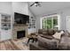 Comfortable living room with a fireplace, built-in shelves, and a large window view at 2646 Lee Lawing Rd, Lincolnton, NC 28092