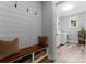 Mudroom features a bench with storage, coat hooks, and access to the laundry room at 2646 Lee Lawing Rd, Lincolnton, NC 28092