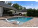 Backyard inground swimming pool with patio furniture and a diving board at 2646 Lee Lawing Rd, Lincolnton, NC 28092
