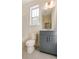 This bathroom features a tub, a shower, a vanity with grey cabinets, and white countertops at 2907 W Trade St, Charlotte, NC 28208