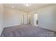 Spacious carpeted bedroom with multiple doors and ample space at 2907 W Trade St, Charlotte, NC 28208