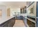Modern kitchen with gray cabinets, a large island, and stainless steel appliances at 2907 W Trade St, Charlotte, NC 28208