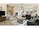 Bright living room featuring modern chandelier, a black leather sofa and natural light at 2907 W Trade St, Charlotte, NC 28208
