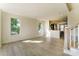 Open-concept living room with abundant natural light and view to kitchen at 2907 W Trade St, Charlotte, NC 28208