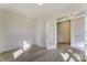 Spacious room with hardwood floors and natural lighting, featuring a doorway and white trim throughout at 2907 W Trade St, Charlotte, NC 28208