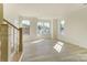 Bright living room with new hardwood flooring and multiple windows at 2907 W Trade St, Charlotte, NC 28208