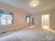 Spacious bedroom with floral wallpaper, carpet floors and natural light at 3015 Hamptonbrook Dr, Gastonia, NC 28056
