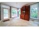 Bright dining area with a charming china cabinet, tile floors, and large windows at 3015 Hamptonbrook Dr, Gastonia, NC 28056
