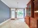 Dining room with tile flooring and a door to the porch at 3015 Hamptonbrook Dr, Gastonia, NC 28056
