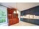Dining area featuring large windows, natural light and built-in wood cabinet at 3015 Hamptonbrook Dr, Gastonia, NC 28056