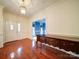 Elegant foyer boasts hardwood floors, neutral decor, and trim detail, leading to other spaces in the home at 3015 Hamptonbrook Dr, Gastonia, NC 28056