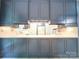 Kitchen with blue cabinetry and white countertops at 3015 Hamptonbrook Dr, Gastonia, NC 28056