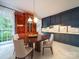 Kitchen and Dining area featuring dark cabinets at 3015 Hamptonbrook Dr, Gastonia, NC 28056