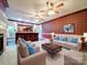 Open living room with a wet bar, fireplace, and multiple seating areas, perfect for entertaining guests at 3015 Hamptonbrook Dr, Gastonia, NC 28056