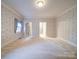 Spacious main bedroom with carpet, wallpaper, and natural light at 3015 Hamptonbrook Dr, Gastonia, NC 28056