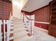 Classic home stairway with patterned wallpaper and wood trim at 3015 Hamptonbrook Dr, Gastonia, NC 28056
