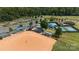 Aerial view of a well-maintained ball field surrounded by lush greenery and community amenities at 31470 Royal Tern Ln, Indian Land, SC 29707