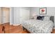 Comfortable bedroom with hardwood floors and closet space near a door at 31470 Royal Tern Ln, Indian Land, SC 29707