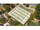 Aerial view of Bocce Ball court areas featuring multiple lanes, shelters and landscaping at 31470 Royal Tern Ln, Indian Land, SC 29707