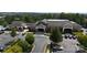 Aerial view of the community clubhouse with beautiful architecture, landscaping, and ample parking at 31470 Royal Tern Ln, Indian Land, SC 29707