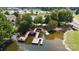 Aerial view of community docks and piers on the lake with lush surrounding landscape and mature trees at 31470 Royal Tern Ln, Indian Land, SC 29707