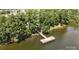 Scenic view of a wooden community pier on the lake with seating and natural surroundings at 31470 Royal Tern Ln, Indian Land, SC 29707