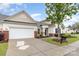 Inviting single-Gathering home with a two-car garage and meticulously maintained front yard for a welcoming appeal at 31470 Royal Tern Ln, Indian Land, SC 29707
