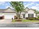 Charming single-story home featuring a well-manicured lawn and inviting front porch, perfect for relaxing at 31470 Royal Tern Ln, Indian Land, SC 29707