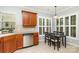 Bright kitchen features stainless steel appliances, wood cabinets and a breakfast table at 31470 Royal Tern Ln, Indian Land, SC 29707