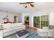 Open living room with seamless access to the dining area, hardwood floors, and comfortable seating at 31470 Royal Tern Ln, Indian Land, SC 29707