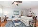 Spacious living room featuring an open layout, a cozy sectional sofa, and stylish décor at 31470 Royal Tern Ln, Indian Land, SC 29707