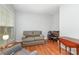Comfortable living room featuring a loveseat, chair, and hardwood floors at 31470 Royal Tern Ln, Indian Land, SC 29707