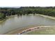 Scenic community pond surrounded by walking paths and lush greenery at 31470 Royal Tern Ln, Indian Land, SC 29707